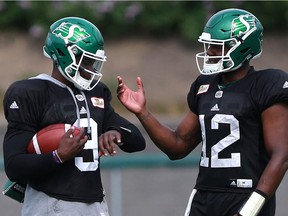 Saskatchewan Roughriders backup quarterbacks David Watford (left) and Marquise Williams practice during day five of Rider Training Camp at SMF Field in Saskatoon, Sask. on May 24, 2018.