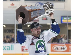 Swift Current Broncos captain Glenn Gawdin hoists the Ed Chynoweth Cup following Game 6 of the WHL final against the Everett Silvertips on Sunday. Photo by Robert Murray/WHL.