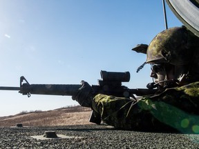 **SAVE FOR FUTURE USE** CFD DUNDURN, SASK : April 28, 2018  -- Tpr Matt McConnell of the Saskatchewan Dragoons takes aim at an enemy position with his C7 rifle as a simulation unfolds during Exercise ARMOURED BISON 2018 at Canadian Forces Detachment Dundurn, northwest of the town of Dundurn, Saskatchewan.
BRANDON HARDER/ Regina Leader-Post