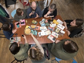 Leader-Post reporter Ashley Martin's book club has been meeting monthly since 2012 in Regina. The table is scattered with some of their past reads at the club's most recent meeting at Malty National. Clockwise from top left, Book Club members are Colleen Book, Patrick Book, Brandi Book, Ashley Martin, Rachel Molnar, Kate Scheurwater, Risa Payant and Virginia Percy.