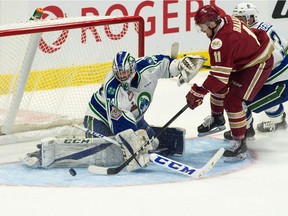 Swift Current Broncos goalie Stuart Skinner stops a shot from Acadie-Bathurst Titan forward Mitchell Balmas during Saturday's game at the Memorial Cup in Regina.