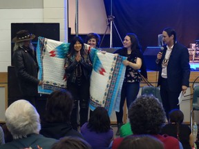 During a tour of Saskatchewan First Nations with the Regina Symphony Orchestra, Buffy Sainte-Marie visits the Cowessess First Nation where she received a star blanket from community members. Photo courtesy Regina Symphony Orchestra.