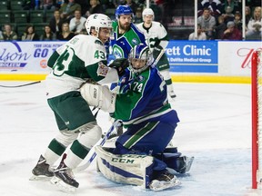 Connor Dewar of the Everett Silvertips gets tangled up with Swift Current Broncos goalie Stuart Skinner during Game 4 of the WHL championship series on Wednesday night in Everett.