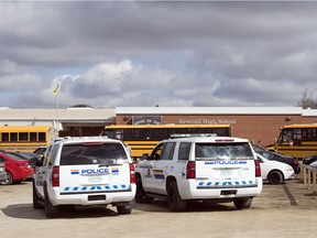 Members of the RCMP White Butte detachment sit outside Greenall High School in Balgonie.