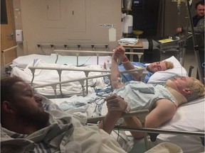 Humboldt Broncos players Graysen Cameron, Derek Patter and Nick Shumlanski hold hands in the hospital following the crash that killed 16 people on April 6.