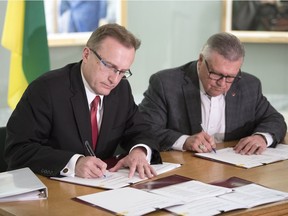 REGINA, SASK :  May 14, 2018  --    Saskatchewan Health Minister Jim Reiter, left, and Ralph Goodale, Federal Minister of Public Safety and Emergency Preparedness, on behalf of Ginette Petitpas Taylor, Federal Minister of Health, sign a bilateral agreement on funding for home and community care, as well as mental health and addiction services in Saskatchewan. TROY FLEECE / Regina Leader-Post