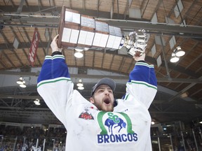 Swift Current Broncos goalie Stuart Skinner hoists the Ed Chynoweth Cup following his team's 3-0 win over the Everett Silvertips in Game 6 of the WHL final on Sunday. Photo by Robert Murray/WHL.