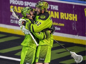 Saskatchewan's Matt Hossack (left) and Mark Matthews celebrate a fourth-quarter goal Saturday night.