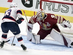 Regina Pats centre Sam Steel is stopped by Acadie-Bathurst Titan goalie Evan Fitzpatrick during their round-robin meeting the Memorial Cup in Regina.