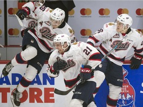 The Regina Pats celebrate Wednesday's 6-5 victory over the Swift Current Broncos and a berth in Friday's Memorial Cup semi-final.