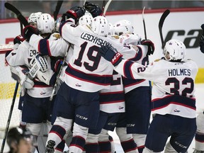 The Regina Pats celebrate a win over the Swift Current Broncos during the Memorial Cup on Wednesday.