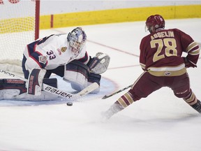 Regina Pats goalie Max Paddock makes a breakaway save on Samuel Asselin of the Acadie-Bathurst Titan during the final game of the 2018 Memorial Cup in Regina.