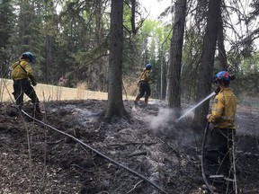 The Rabbit Creek wildfire continues to burn in Prince Albert National Park. A photo distributed on May 19, 2018, shows some of the fire management work being done. (Parks Canada Photo)