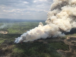 A column of smoke coming from a wildfire at Rabbit Creek in the Prince Albert National Park.