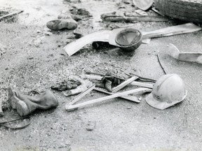 WEBB, SASK., May 28, 1980 — A CP Rail workman's hard hat and boots bear witness to a flaming three-vehicle crash which claimed 22 lives at Webb, Sask. Witnesses at the scene said as many as two dozen blue hardhats lay scattered on the Trans-Canada Highway, along with clothing of the victims. A car, bus and semi-trailer tank truck were involved in the crash. The bus and truck were almost burned beyond recognition. (LP file photo by Colleen Stepan)