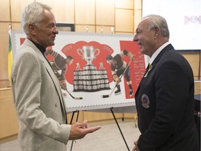 2018 Memorial Cup honorary co-captains Dennis Sobchuk, left, and Guy Lafleur are shown at Friday's unveiling of a Canada Post stamp that commemorates the 100th-anniversary event.
