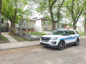 A police cruiser sits out in front of a home on the 1100 block of Retallack Street.