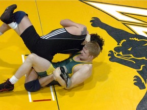 The University of Regina has made a controversial decision to eliminate three programs — men's and women's wrestling, and men's volleyball.