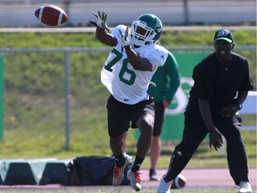 Receiver Kyran Moore keeps his eye on the ball during the Riders' training camp.