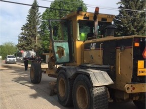 Damage to a City of Saskatoon grader is visible after an incident on Thursday morning where a man attacked the piece of equipment with a baseball bat and what police called a "simple incendiary device" in the 1500 block of Hilliard Street East. He's now facing numerous charges as a result of the attack.