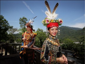 Ljavuas and Makueskes, from the Paiwan tribe, wore wedding clothes for engagement photos at the Indigeneous Peoples' Cultural Park near the Ailioa River in southern Taiwan April 11, 2018. (Photo by David Conachy) (Adam-Taiwan)