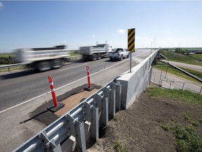 NDP highways and infrastructure critic Buckley Belanger and Balgonie resident Jesse Edwards held a news conference near the bridge they say is in poor shape just east of Regina on the Trans-Canada Highway.