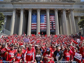 Fans gather on the steps of the National Archives Building as they wait to watch the Washington Capitals' Stanley Cup victory parade on Tuesday.