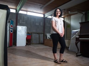 Rochelle Berenyi, communications, advocacy and projects officer for Carmichael Outreach, stands in the organization's new building on 12th Avenue.