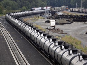 A northbound oil train sits idled on tracks, stopped by protesters blocking the track ahead, in Everett, Wash., on September 2, 2014. The National Energy Board says exports of Canadian crude oil by rail to the United States jumped to a three-year high in March. In a report, the federal agency says crude-by-rail volumes reached just over 170,000 barrels per day, the highest since December of 2014 and nearing the six-year high of 179,000 bpd exported by rail in September 2014.