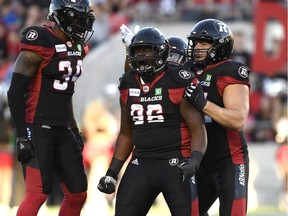 Ottawa Redblacks' Mike Wakefield, 96, celebrates a sack against the Saskatchewan Roughriders on Thursday.