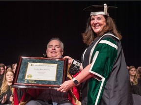 Brad Hornung, former Regina Pats star and University of Regina alumnus, receives an honorary degree during a convocation ceremony at the Conexus Arts Centre. Presenting Hornung with the certificate is the university's president, Vianne Timmons.