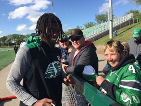 Receiver/defensive back Duron Carter interacted with a fan during the Saskatchewan Roughriders Green and White Day on Saturday.