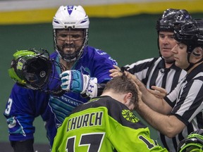 Rochester Knighthawks defender Billy Dee Smith, left, knocks off Saskatchewan Rush forward Robert Church's helmet on his way to the penalty box during the forth quarter of Game 1 of the National Lacrosse League final in Saskatoon on Saturday, May 26, 2018. The best-of-series, now tied 1-1, heads back to Saskatoon on Saturday, June 9.