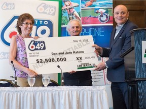 June Katona, left and Don Katona receive a symbolic cheque indicating their $2.5-million dollar Lotto 649 lottery win at the Hotel Saskatchewan.