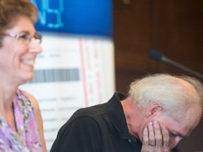 REGINA, SASK : June 22, 2018  -- June Katona, left and Don Katona react while members of the media ask questions following the announcement of their $2.5 million dollar Lotto 649 lottery win at the Hotel Saskatchewan on Victoria Avenue. BRANDON HARDER/ Regina Leader-Post