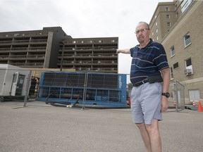 Mike Chipley points to where he lives in a building that is beside an extremely noisy chiller machine he says is constantly roaring behind the Hotel Saskatchewan in Regina.