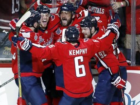 Capitals forward Alex Ovechkin, centre, celebrates with teammates after scoring a goal against the Golden Knights during the second period in Game 3 of the Stanley Cup Final, Saturday, June 2, 2018, in Washington.