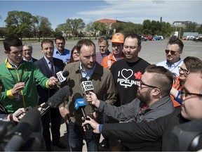 NDP Leader Ryan Meili held an outdoor press conference to propose a way to help create jobs in the steel industry and improve pipeline safety in Saskatchewan.  The event was held in the parking lot of the Turvey Centre.