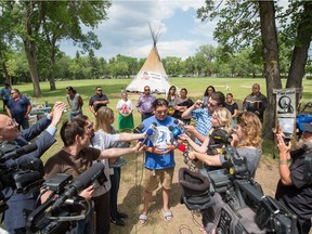 Federation of Sovereign Indigenous Nations chief Bobby Cameron speaks to members of the media at the Justice for our Stolen Children camp across from the Saskatchewan legislative building, which was resurrected just days after police oversaw its deconstruction.