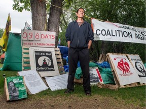 Prescott Demas stands at a protest camp in front of the Saskatchewan legislative building.