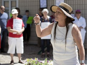 Wendy Lerat, Indigenous studies professor at the First Nations University of Canada, speaks at the Council of Canadians rally outside against the federal governments' purchase of the Kinder Morgan pipeline. The rally took place outside of MP Ralph Goodale's Regina office.