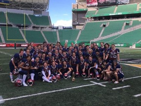 The Regina Riot poses for a picture at Mosaic Stadium on Sunday after defeating the Edmonton Storm 45-9 in a Western Women's Canadian Football League playoff game.