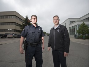 Staff Sgt. Brad Walter, left, and Jamie Hanson, manager of facilities and engineering with the City of Regina and project lead for the new RPS headquarters, stand outside the current RPS headquarters and former STC bus terminal in Regina.