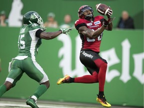 Saskatchewan Roughriders safety Mike Edem can't stop Calgary Stampeders slotback Kamar Jorden from catching a touchdown pass during Friday's CFL pre-season game at Mosaic Stadium.