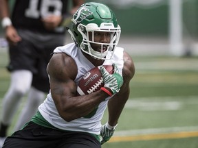 Roughriders running back Marcus Thigpen runs the ball during practice at Mosaic Stadium in Regina.