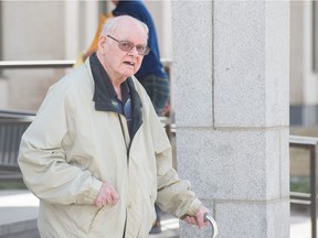 Retired priest Robert MacKenzie leaves the Court of Queen's Bench in Regina on May 4, 2018.