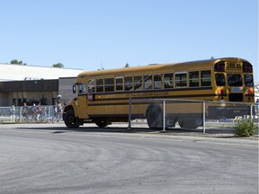 A bus drops students off at St. Marguerite Bourgeoys elementary school in Regina.