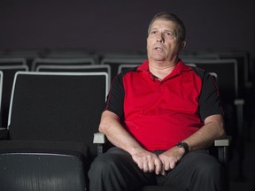Wilf Runge, manager of the Rainbow Cinema, sits inside theatre 8 in Regina.