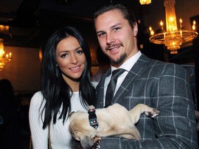 Ottawa Senators captain Erik Karlsson, joined by his girlfriend Melinda Currey, cuddled this pup, a Boston Terrier/Pug mix named Dweeble, at a benefit dinner for the Sit With Me shelter dog rescue, held at Salt restaurant in Little Italy on Monday, October 26, 2015.