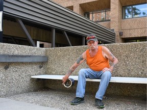Nino Dudra, 66, in front of the Saskatchewan Housing Corporation-owned Shepherd Apartments in Saskatoon, one of many buildings across the province that will be made completely non-smoking on Aug. 1.